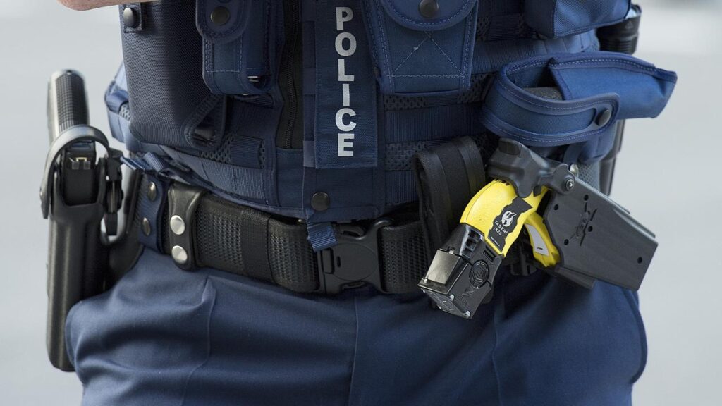 Police used a Taser to subdue and handcuff a teenager when she pointed a knife at two officers.
