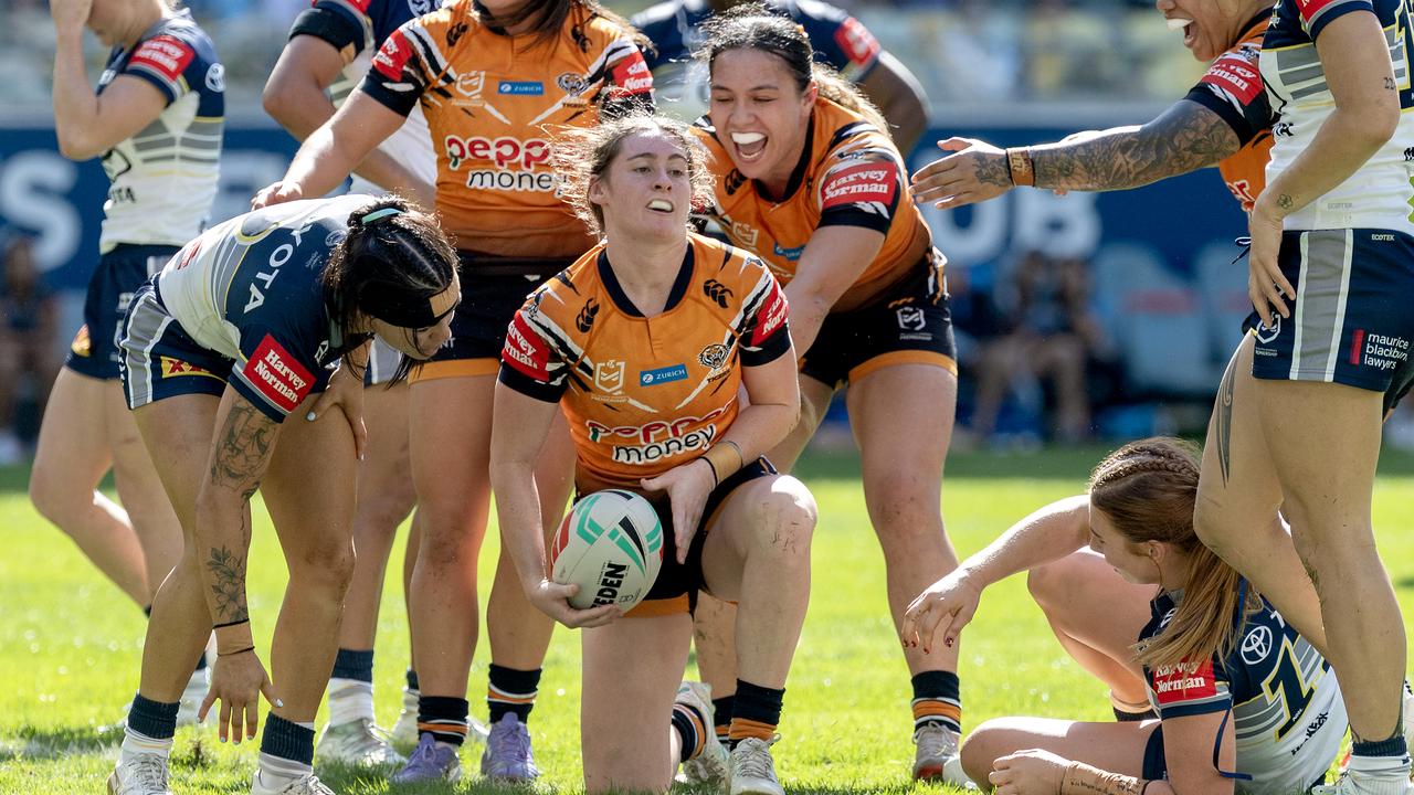 Faythe Manera of the Tigers celebrates with teammates after a try