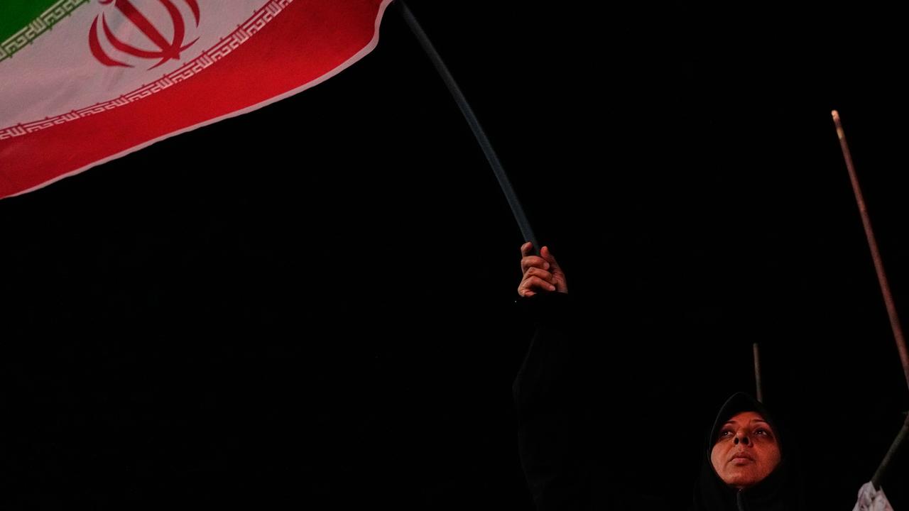 An Iranian pro-government demonstrator in Tehran, Iran