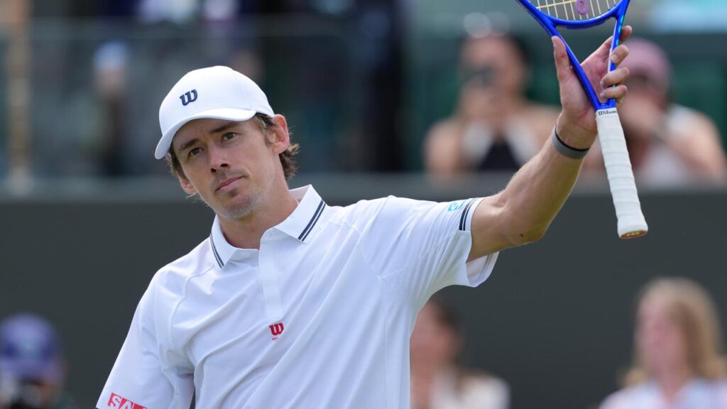 To chants of ‘Aussie, Aussie, Aussie’ Alex de Minaur salutes after opening his Wimbledon with a win.
