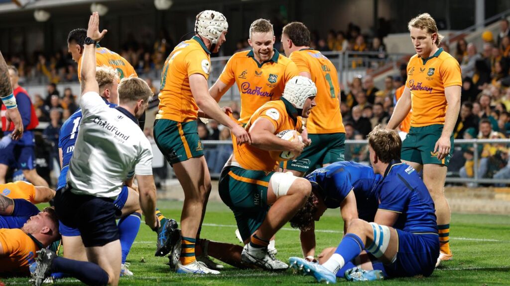 Josh Canham wrote his name in the history books with a hat-trick for the Wallabies against Italy.
