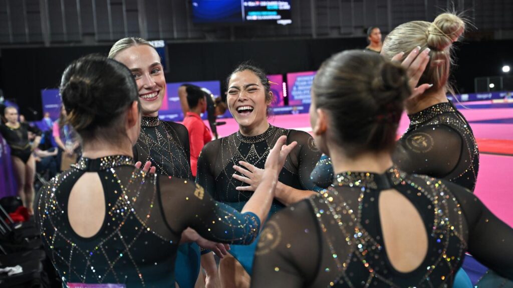 Georgia Godwin (centre) has led Australia to a gold medal in the Artistic Gymnastics Women’s Teams.
