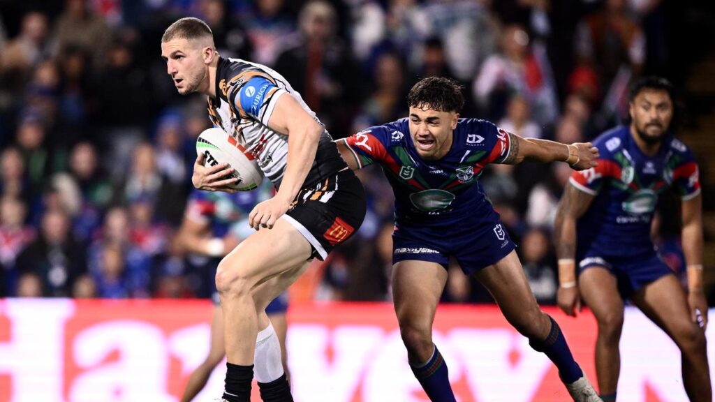 Tiger Adam Doueihi is free to play on after having his high tackle charge downgraded.
