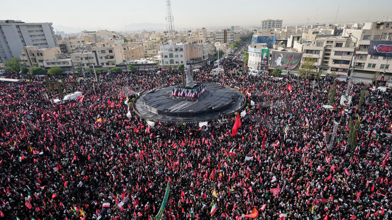 Mourners gather in and around Islamic Revolution Square in Tehran