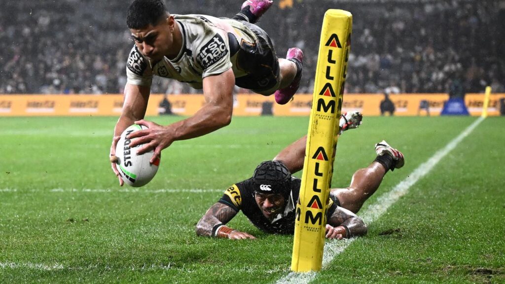 Josiah Karapani gets airborne to score a try in Brisbane’s victory over Penrith in Sydney.
