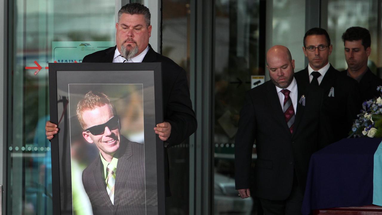 A photo of Damian Leeding carried during his funeral (funeral)