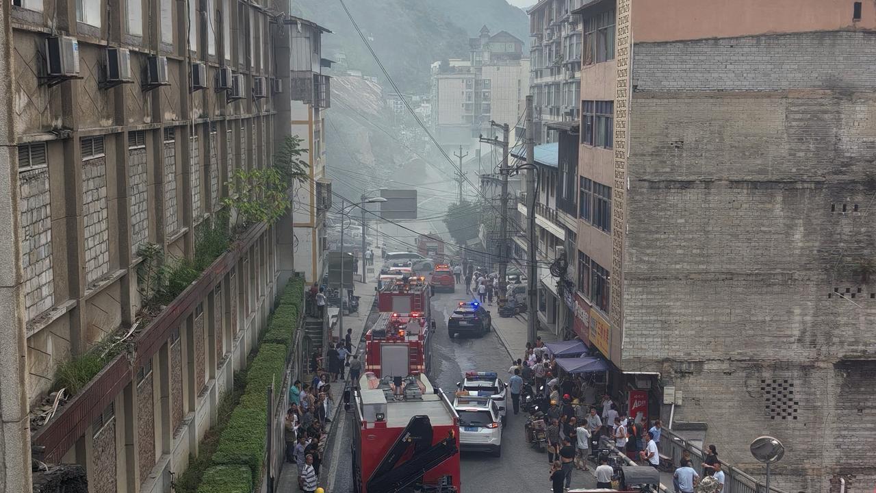 Firefighters arrive to the landslide scene in China's Chongqing
