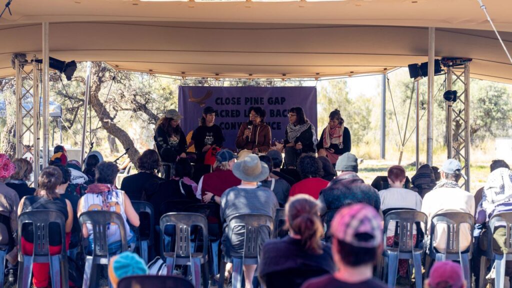 Anti-US alliance advocates have gathered near Alice Springs to demand the closure of Pine Gap.
