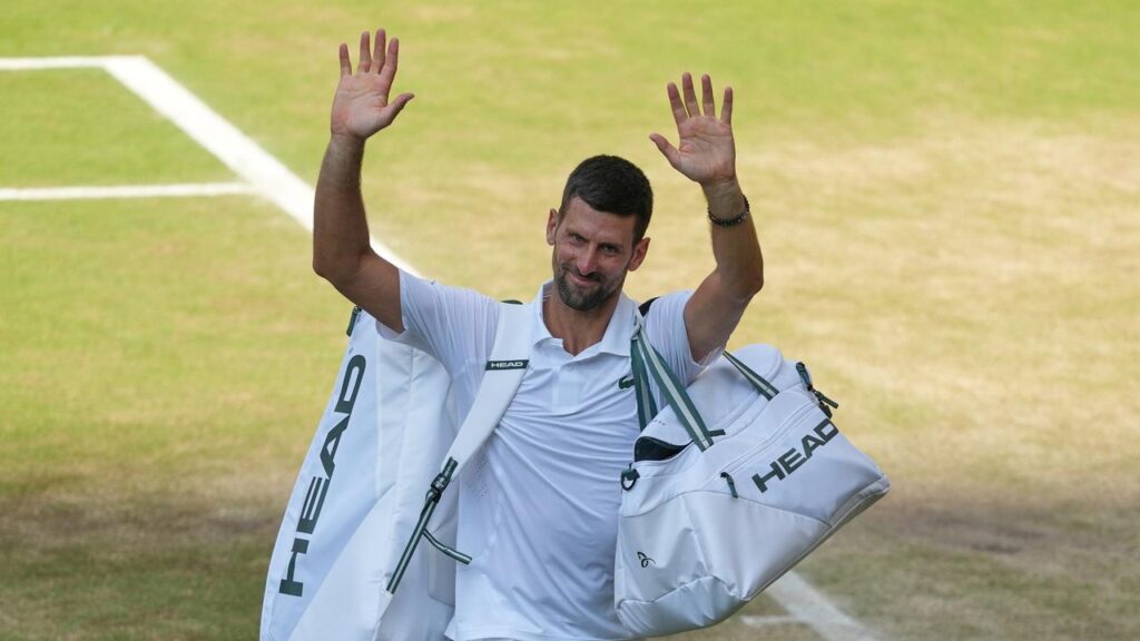 Novak Djokovic waves to the crowd after his defeat on Centre Court by Jannik Sinner.
