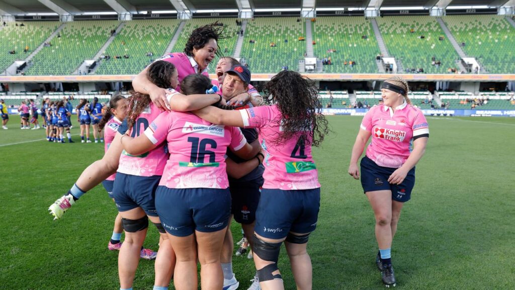 Waratahs players celebrate after qualifying for the Super Rugby Women’s grand final.
