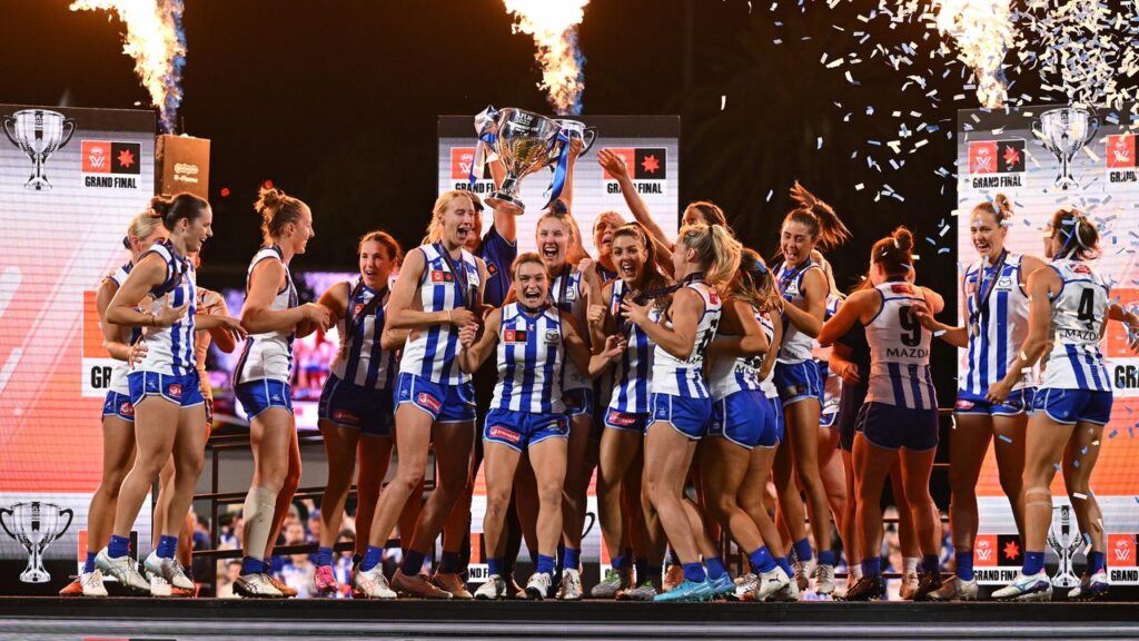 North Melbourne celebrate their 2025 AFLW grand final triumph, played on a Saturday.
