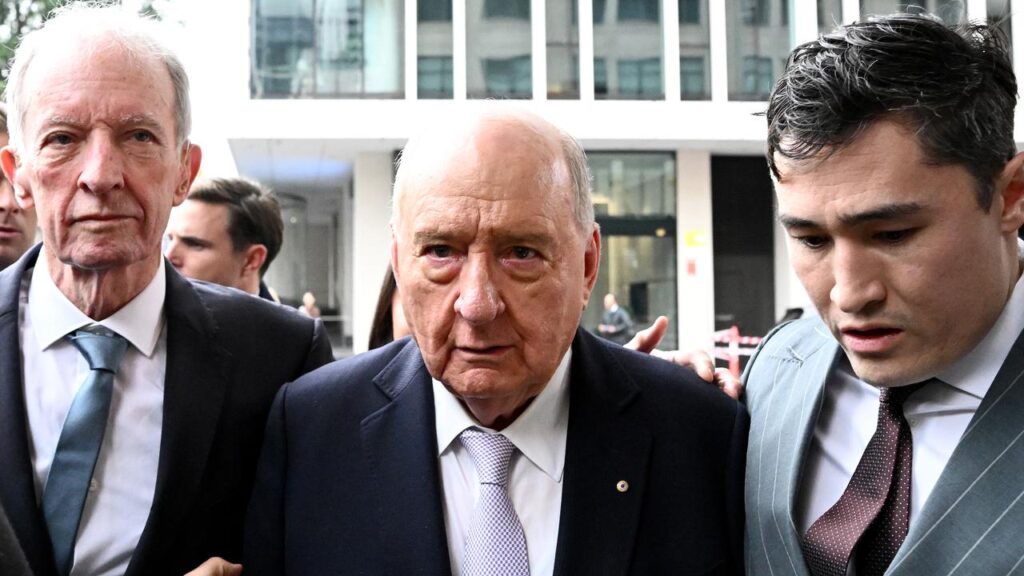 Alan Jones (centre) has pleaded not guilty to indecent assault and sexual touching without consent.
