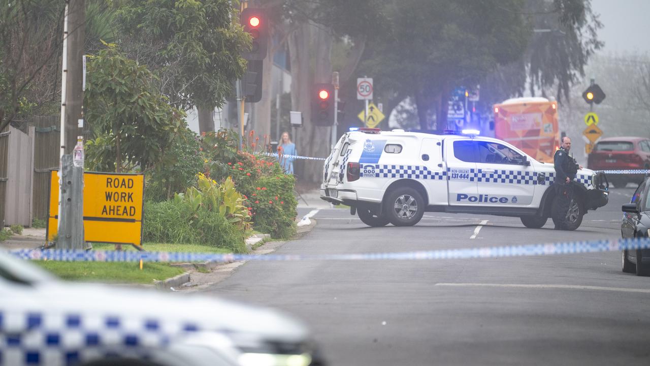Police close off a street at a crime scene