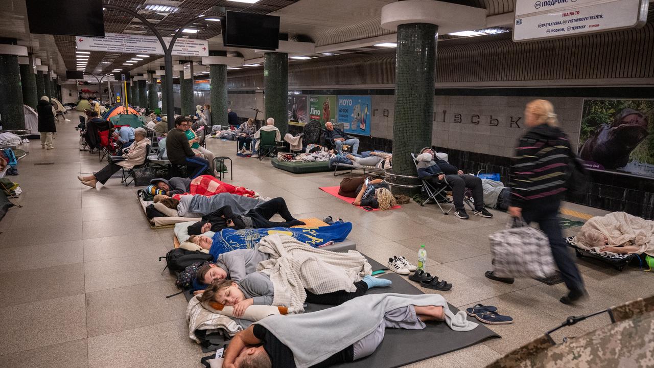 People shelter in a metro station during a Russian attack, in Kyiv
