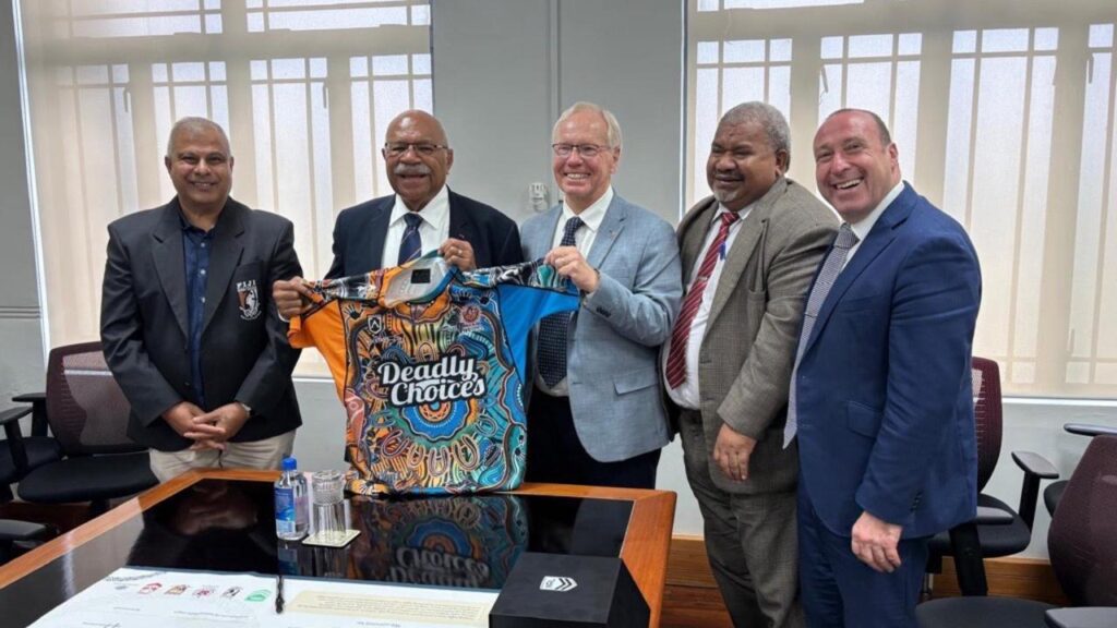 Fiji PM Sitiveni Rabuka (2nd left) and ARLC boss Peter Beattie (centre) at the announcement in Suva.
