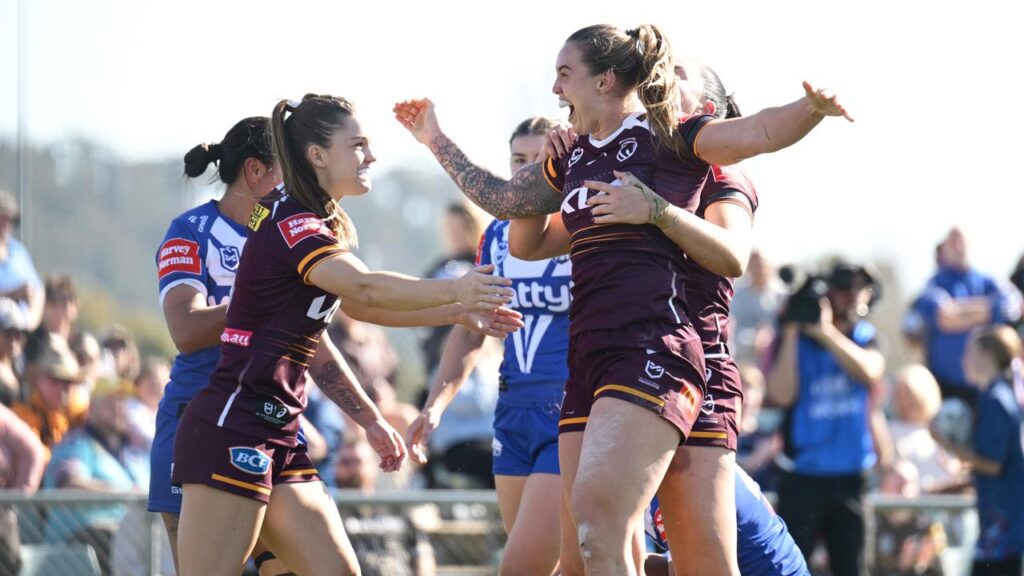 Dominant: Brisbane players celebrate a try as they thumped the Bulldogs in Magic Round.
