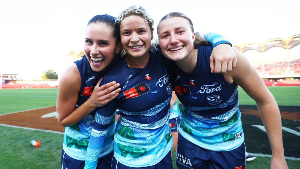 Georgie Prespakis (C) celebrates after leading Geelong to a tense AFLW victory over Gold Coast.
