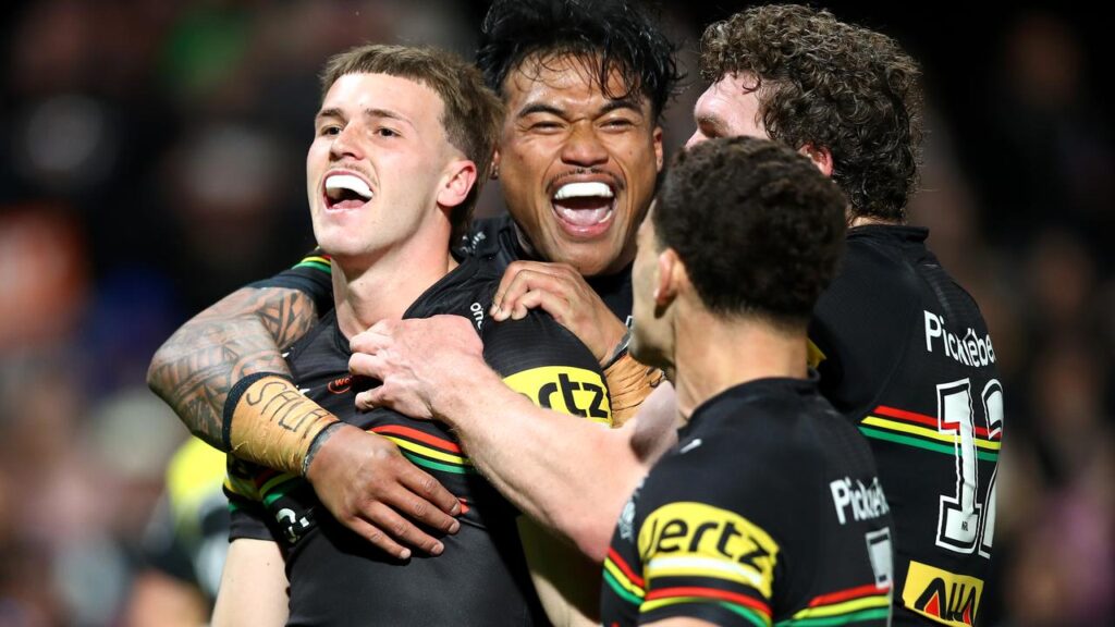 NEW KID ON THE BLOCK: Penrith’s Jaxen Edgar (left) celebrates his maiden NRL try against Canberra.
