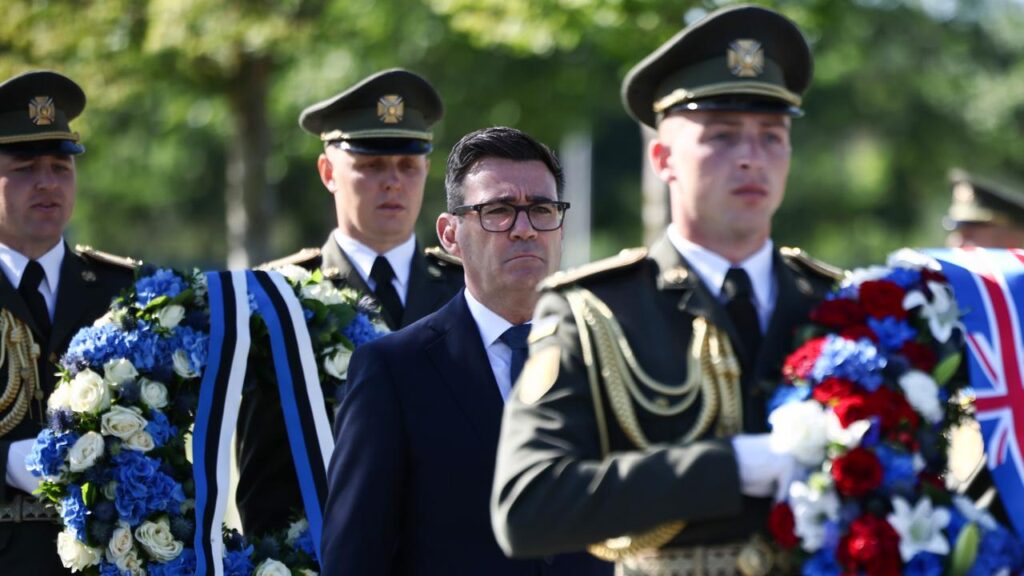 UK Prime Minister Andy Burnham attends a ceremony at the tomb of the unknown Ukrainian soldier.
