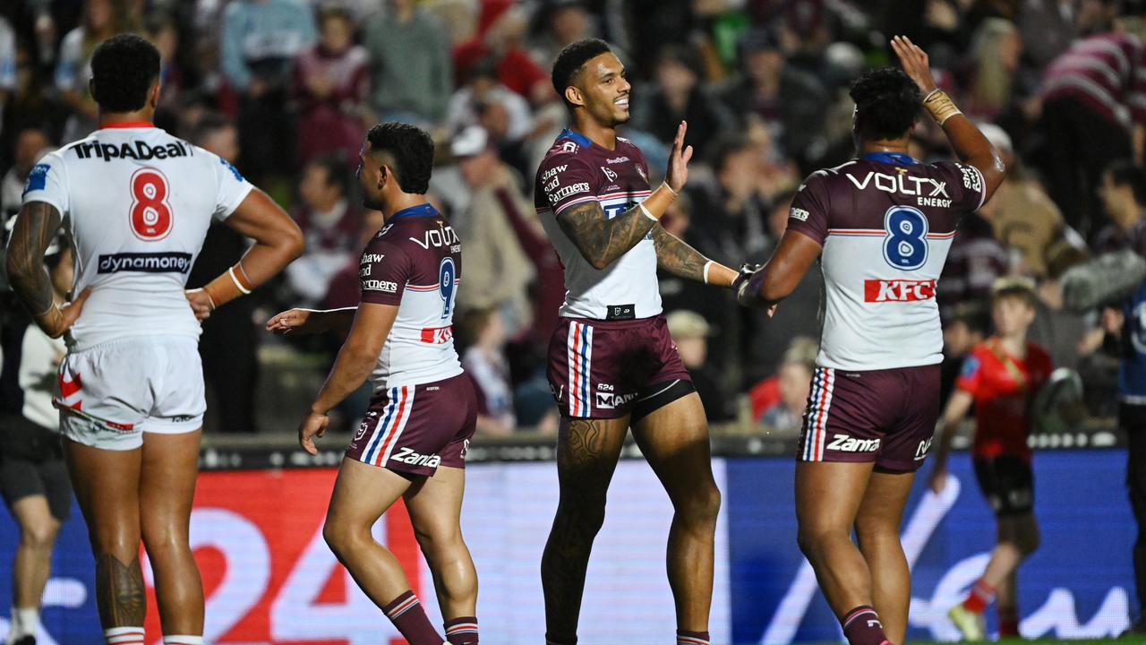 Jason Saab of the Sea Eagles celebrates after scoring a try