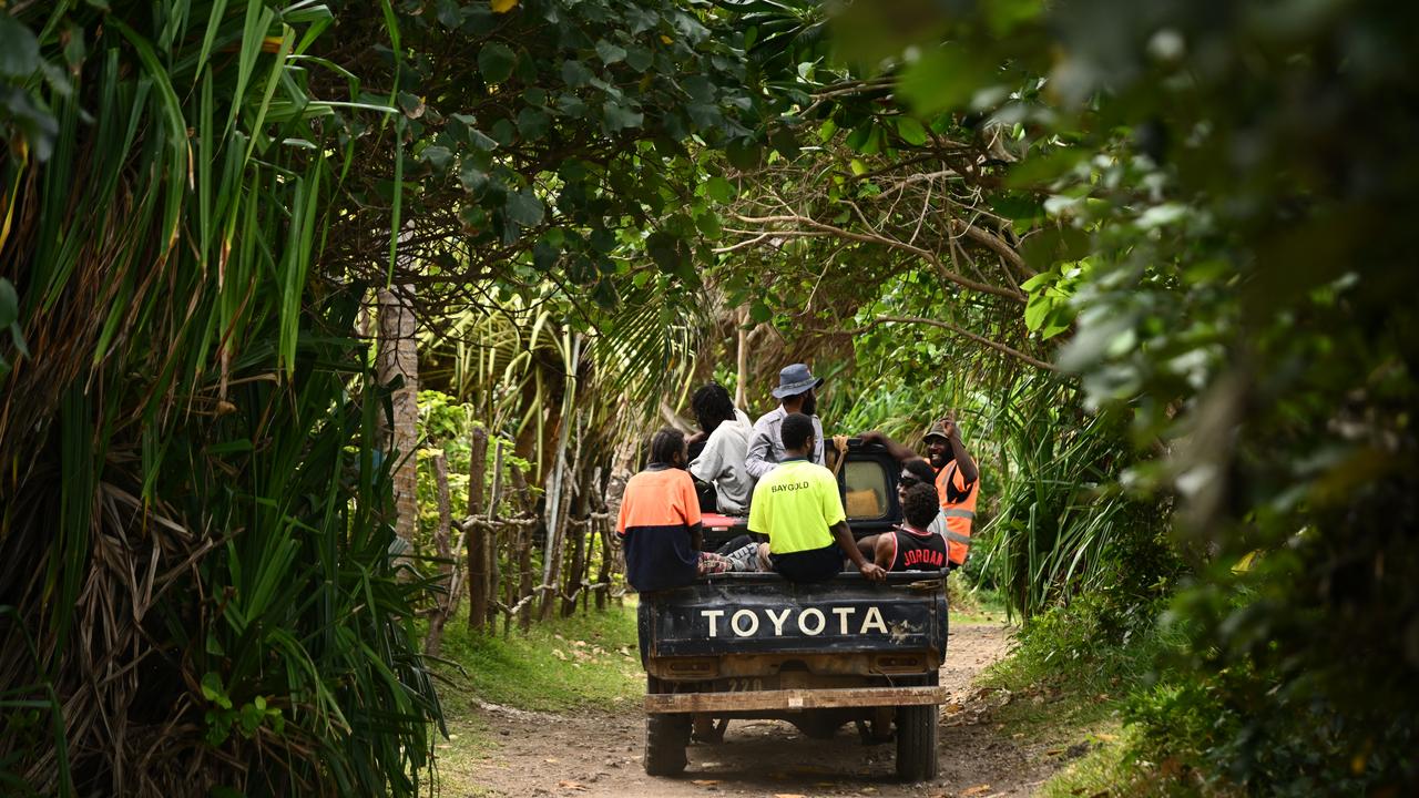 Locals return from work on Nguna Island, Vanuatu,