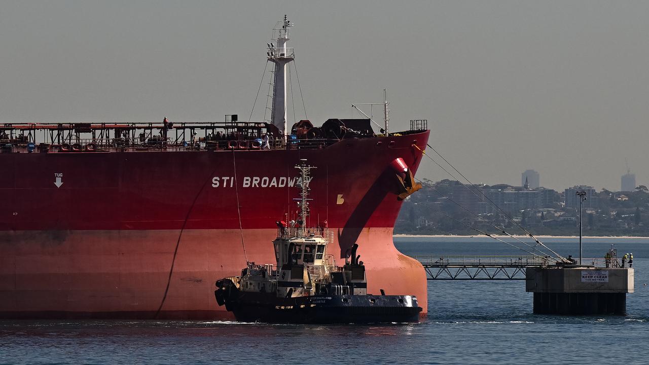 A tugboat next to Crude Oil Tanker Sti Broadway
