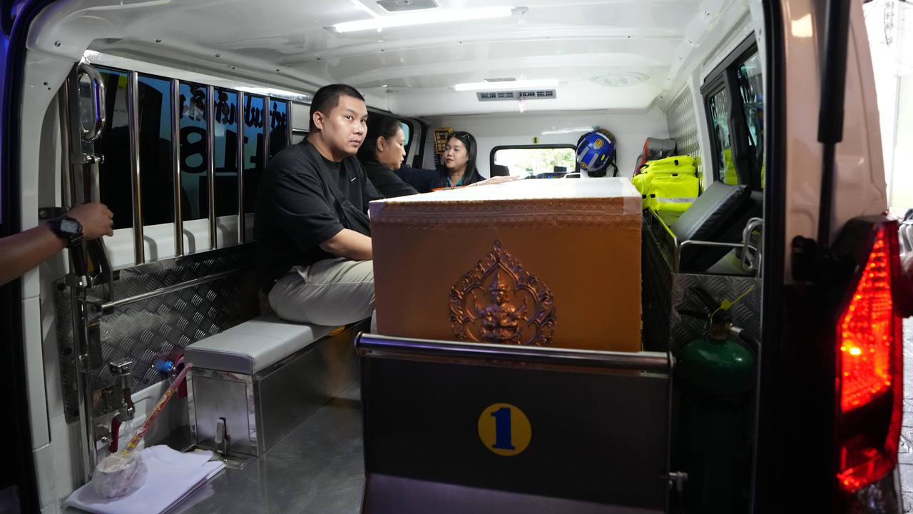 A coffin containing the body of a school shooting victim in Thailand