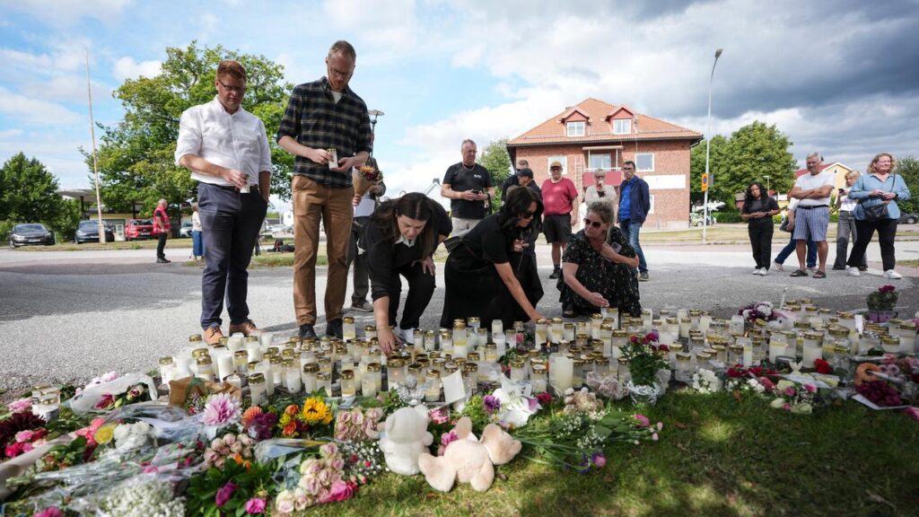 People are laying tributes at a makeshift memorial after a deadly attack at a school in Sweden.
