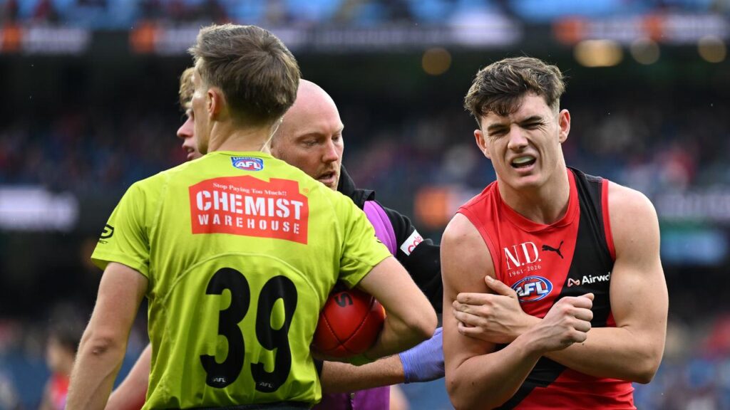 Archie Roberts dislocated his shoulder against Melbourne but delayed surgery for Essendon’s cause.
