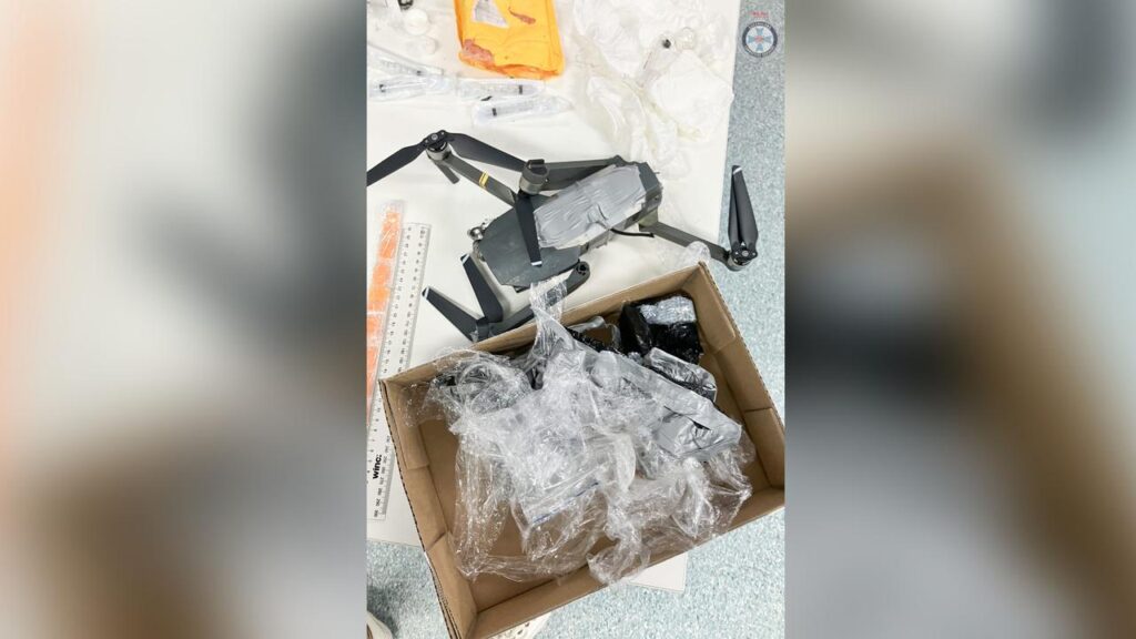 A man has been charged after a drone allegedly carried drugs, a glass pipe and a phone into prison.
