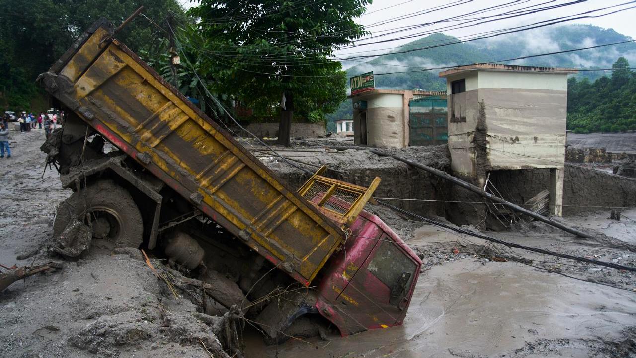 A vehicle is seen in the aftermath of a flash floods in Nepal