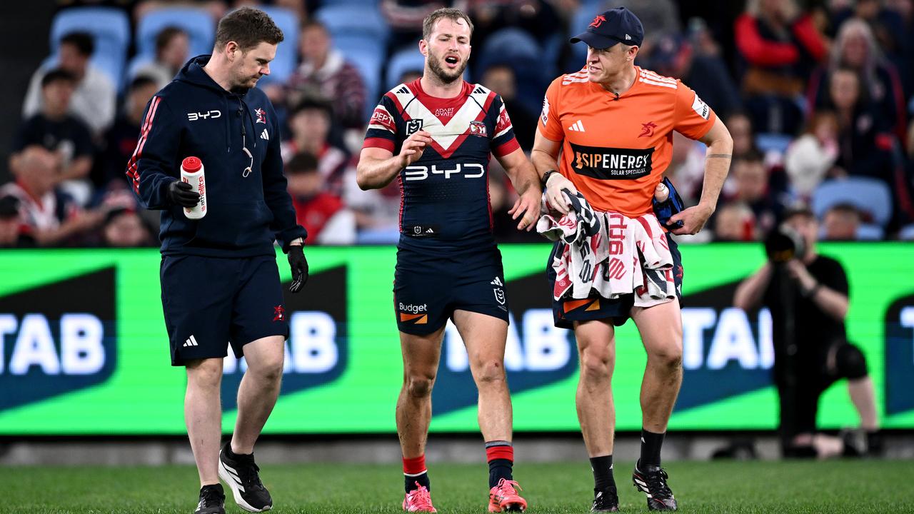 The Sydney Roosters' Sam Walker was helped from the field.