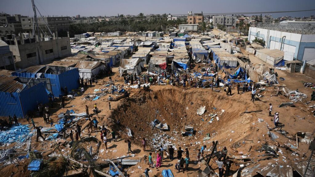 Medical supplies appear to be strewn on the side of a crater marking Israel’s latest strike on Gaza.
