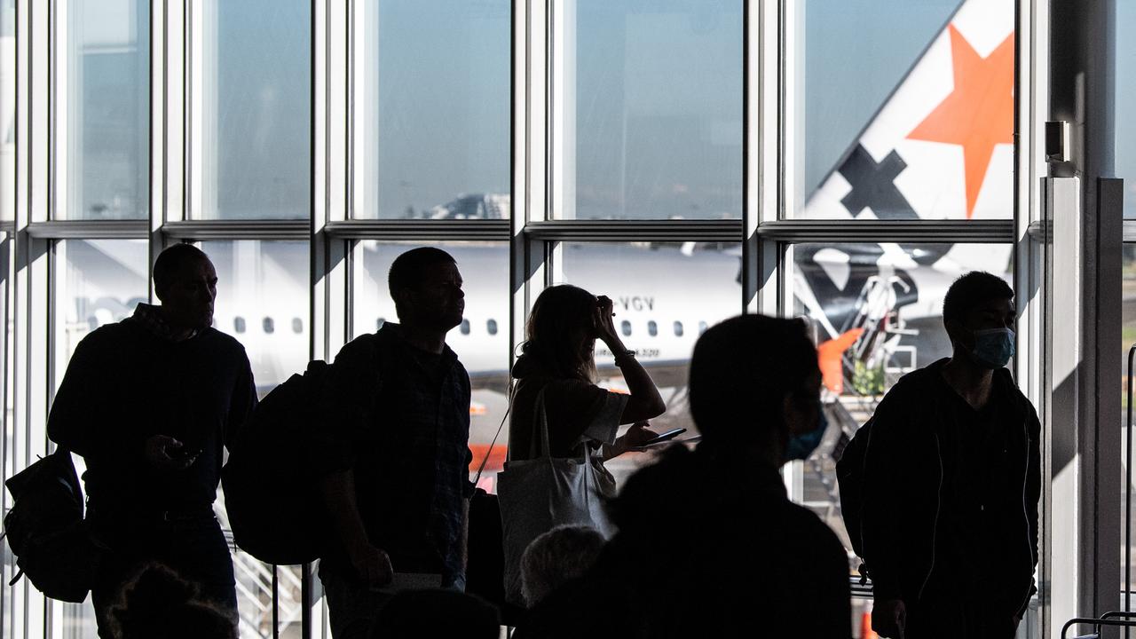 Passengers waiting to board a Jetstar flight