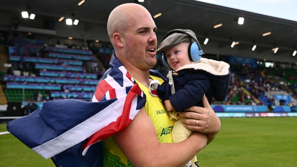 Matt Denny celebrated with son Roman after winning gold in Glasgow.
