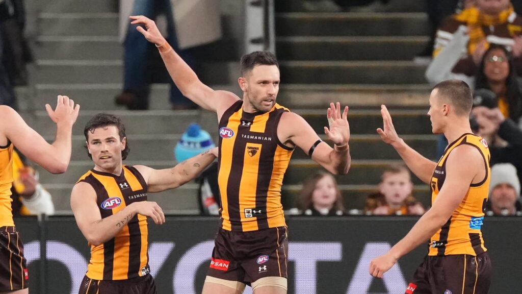 Jack Gunston (centre) will play his 300th AFL game when Hawthorn meet West Coast.
