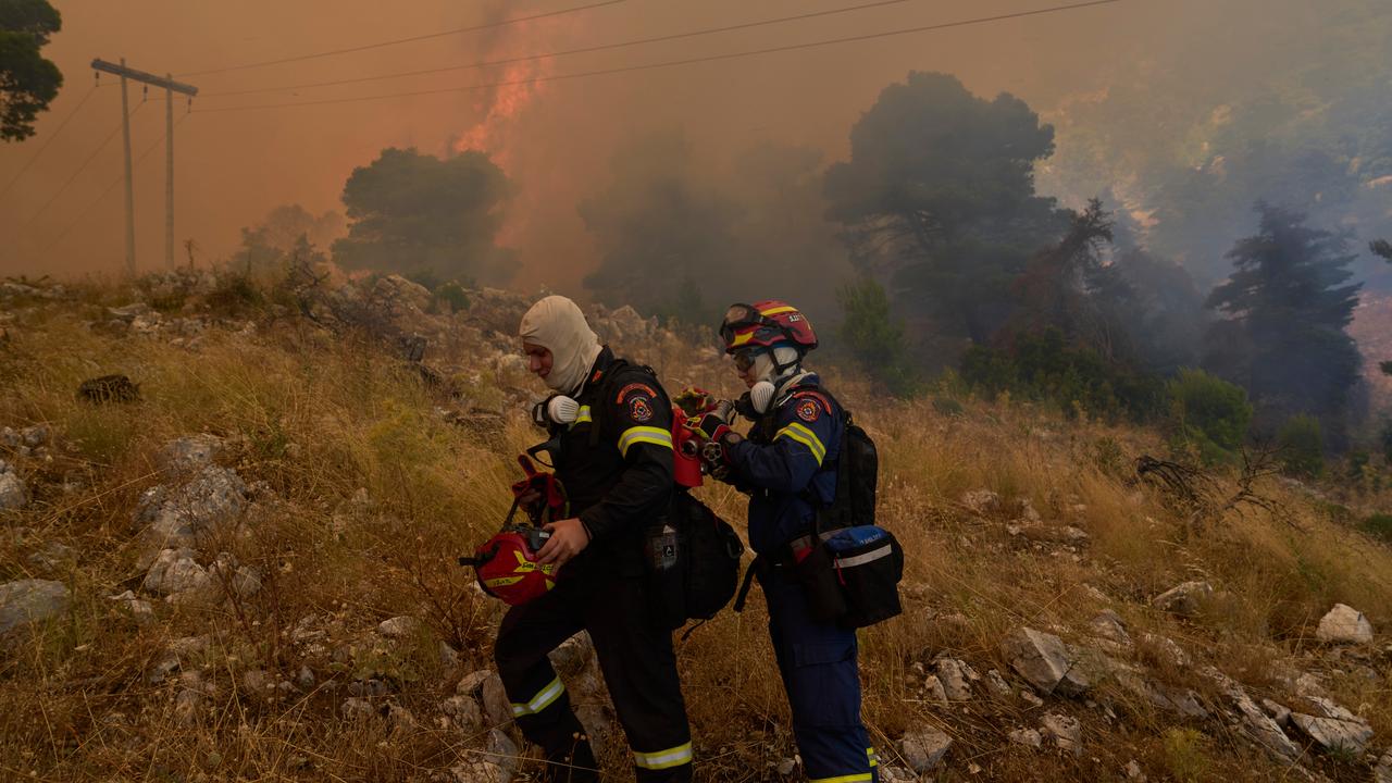 Firefighters operate on Mount Kithairon near Porto Germeno, Greece