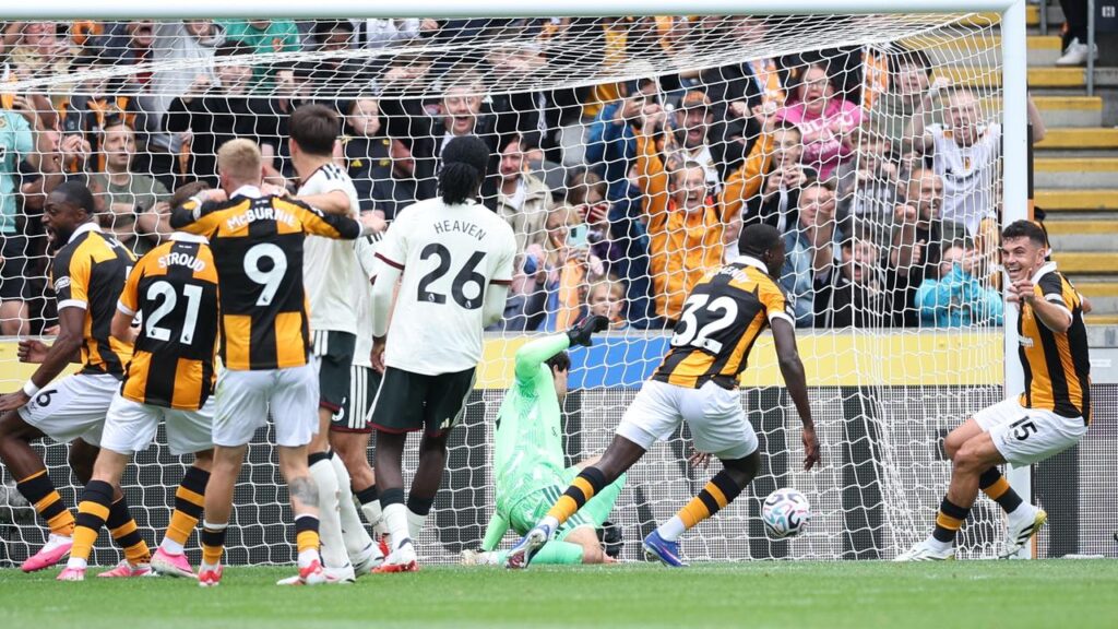 Hull’s No.32 Nobel Mendy wheels away after scoring their second goal in the win over Man United.
