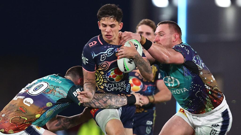 North Queensland’s John Bateman (left) and Coen Hess (right) focus on their defensive job.
