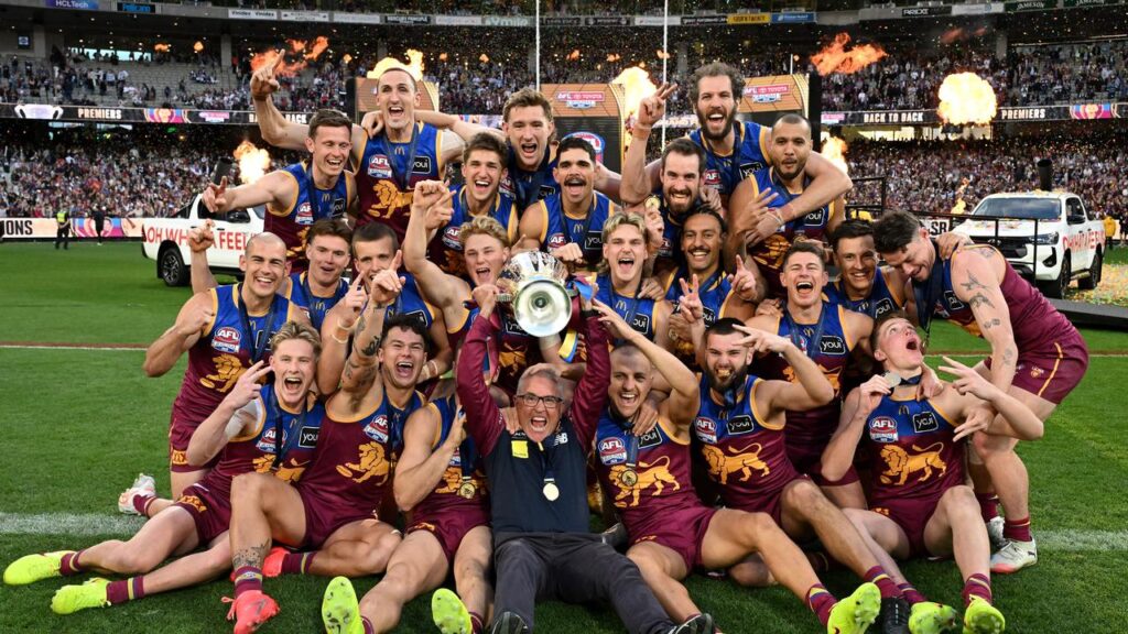 Chris Fagan (centre) is about to set a record previously held by Leigh Matthews.
