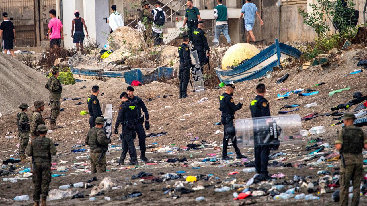 Spanish soldiers and Guardia civil officers stand guard in Ceuta