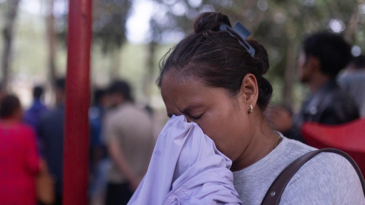 A woman weeping in the flood zone