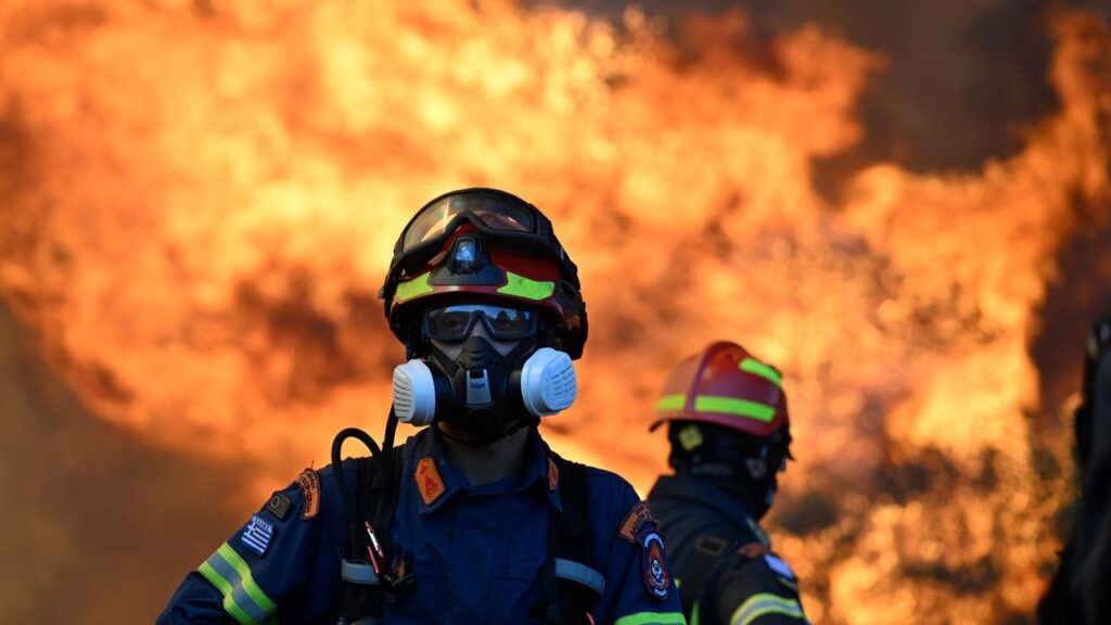 The flames from a major fire have spread to within a few kilometres of the coastal town of Megara.

