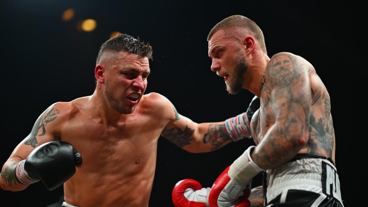 Koen Mazoudier and Sam Beck trade blows in their  middleweight bout.