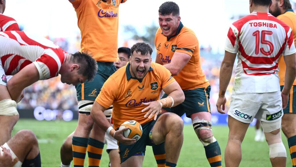 Prop Massimo De Lutiis celebrates after scoring on debut as the Wallabies beat Japan in Townsville.
