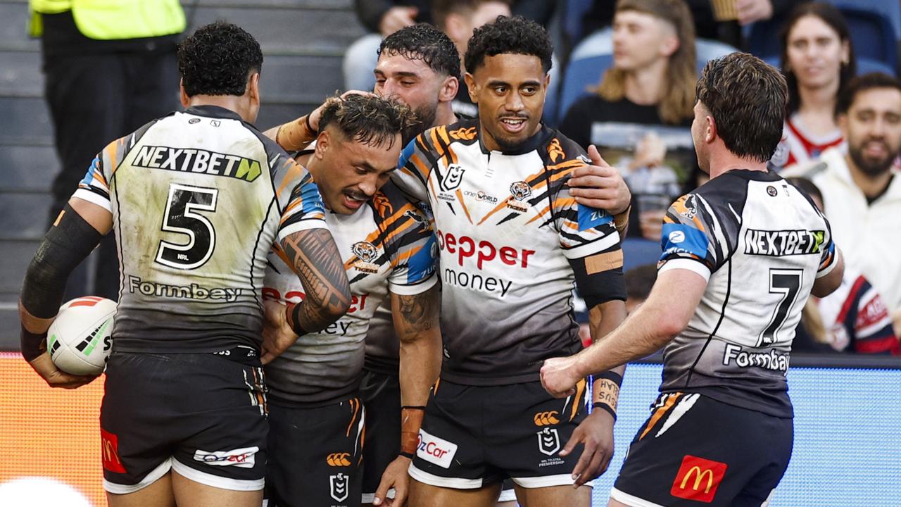 Celebrating Wests Tigers players.