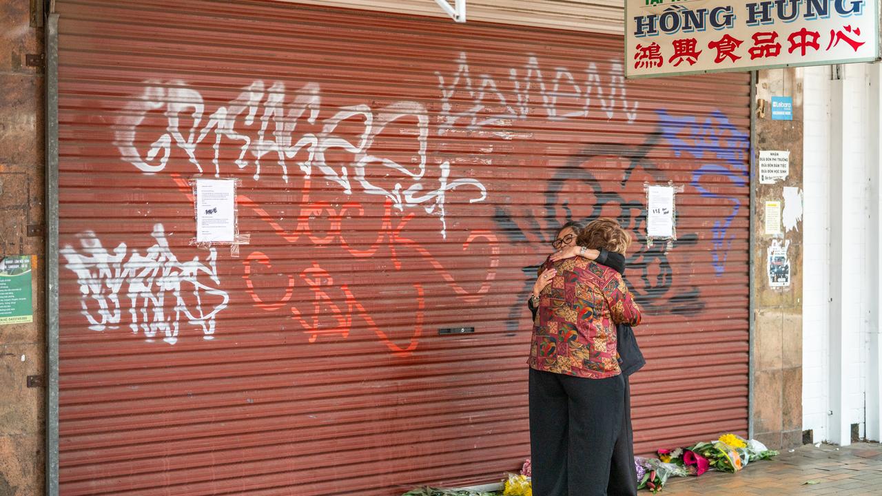 Women hug outside Hong hung