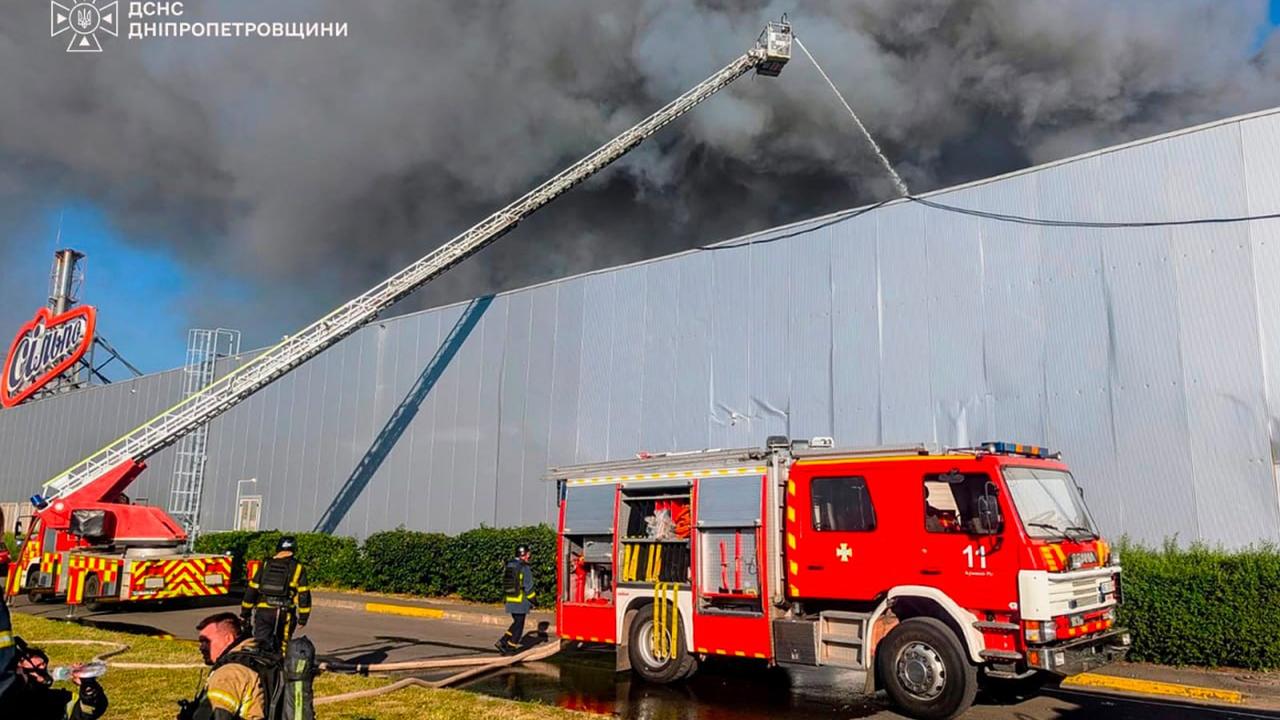 Firefighters at a shopping mall after a Russian attack in Kryvyi Rih