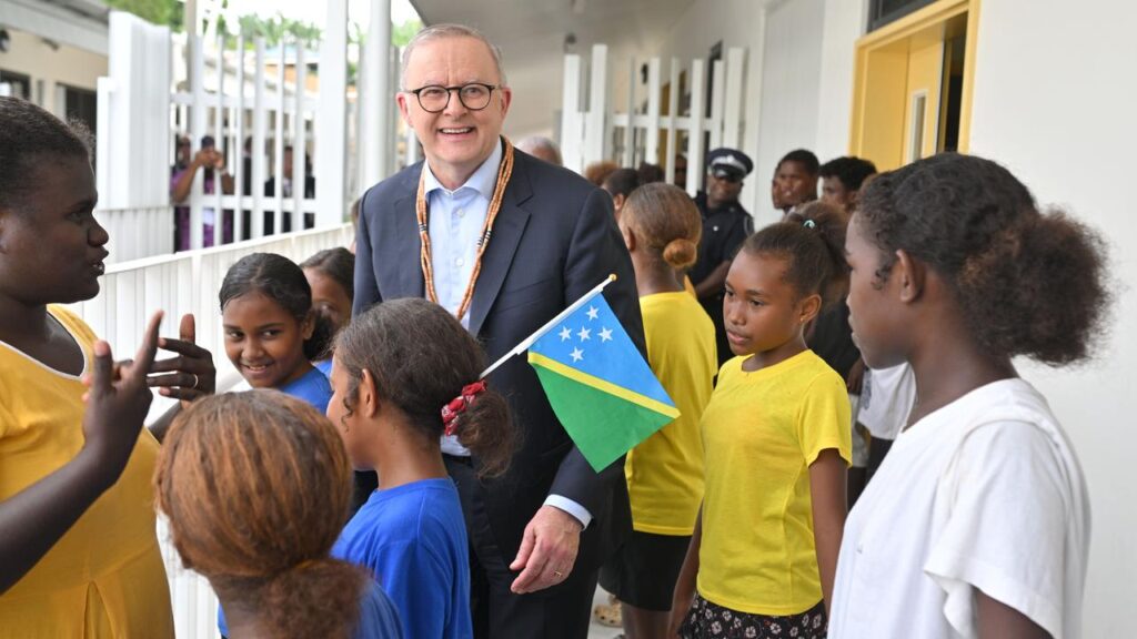 Australia is promising aid to the Solomon Islands to fund free education and security improvements.
