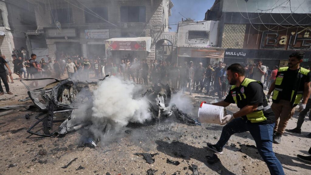 An Israeli air strike hit a vehicle in western Gaza City, killing at least three people, medics say.
